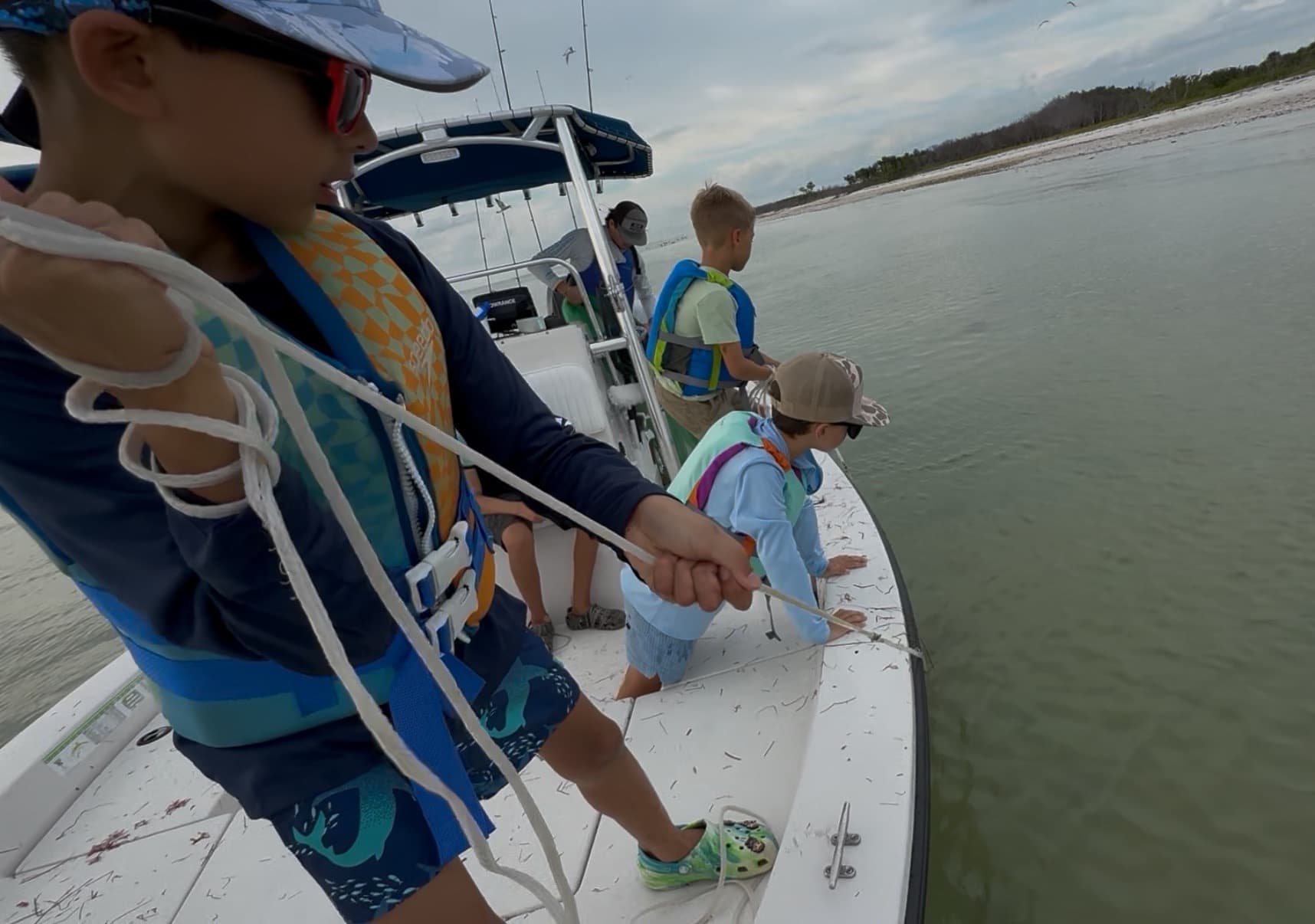 Kids fishing on open water